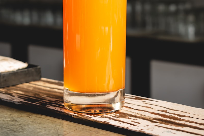 A tall glass of iced cold-brewed tea with condensation on the outside